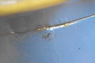 Very slight evidence of rust in seam on one side of rear sill
